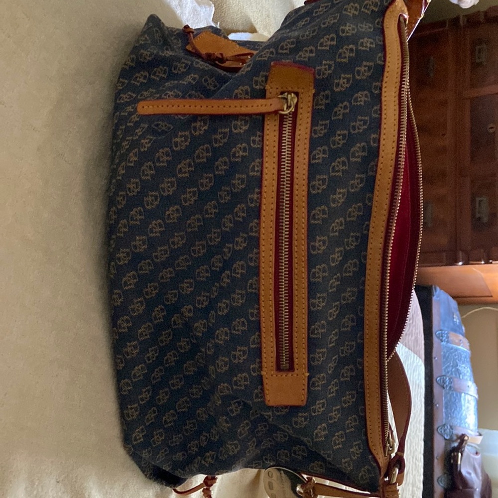 Dooney and Bourke blue cloth shoulder bag.